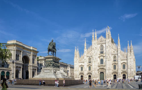 Milan Cathedral (Duomo di Milano) and Vittorio Emanuele II equestrian statue at Cathedral square of Milan, Lombardy, Italy. Famous tourist attraction of Milan, Italy.